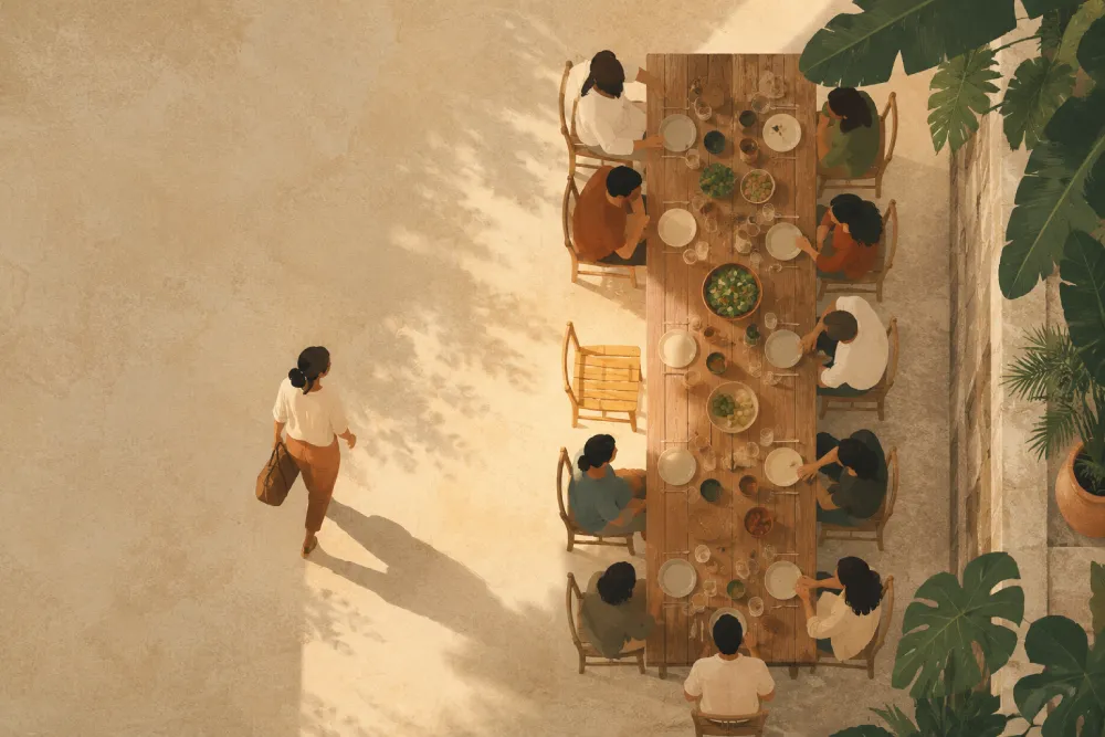 Illustrated aerial view of guests sharing a communal dinner table at a wellness retreat, one more arriving to join them